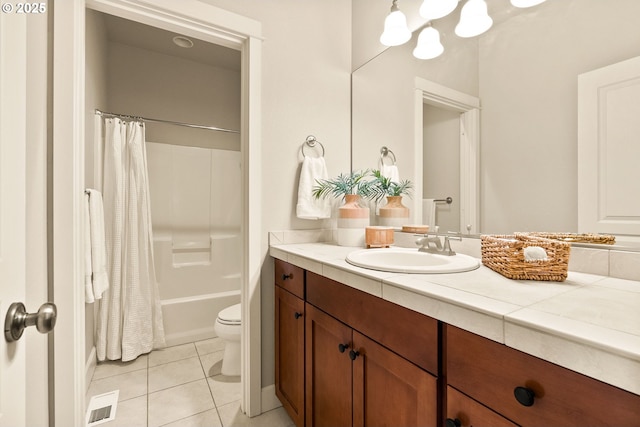 full bathroom featuring toilet, vanity, tile patterned floors, and shower / bath combination with curtain