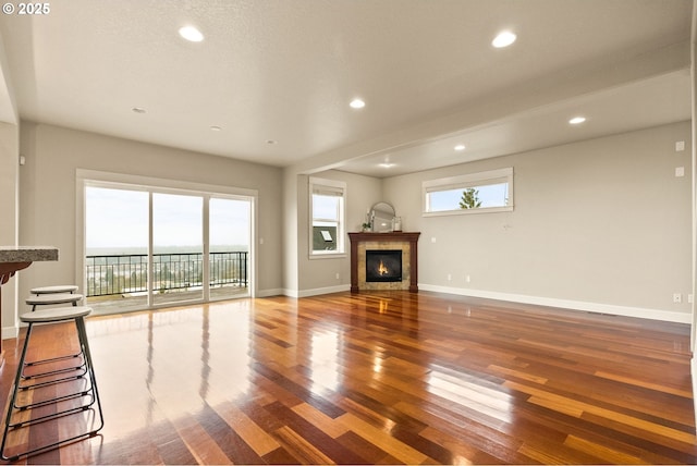 unfurnished living room featuring wood-type flooring