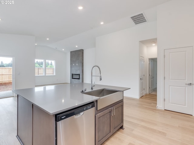 356 NW 29th Way, Battle Ground, WA 98604 - kitchen featuring stainless steel dishwasher, light wood-style floors, vaulted ceiling, a sink, and an island with sink