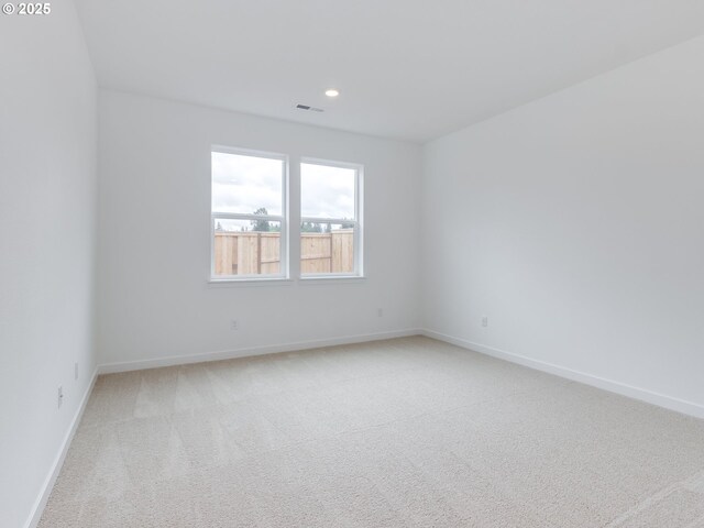356 NW 29th Way, Battle Ground, WA 98604 - spare room featuring light carpet, recessed lighting, and baseboards