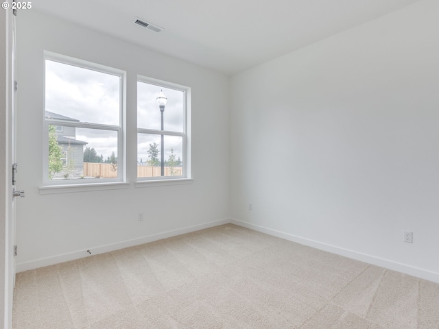 356 NW 29th Way, Battle Ground, WA 98604 - empty room with light carpet, plenty of natural light, and baseboards