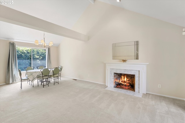20198 SW Tillamook Ct, Tualatin, OR 97062 - dining space with a chandelier, carpet floors, a high end fireplace, and high vaulted ceiling