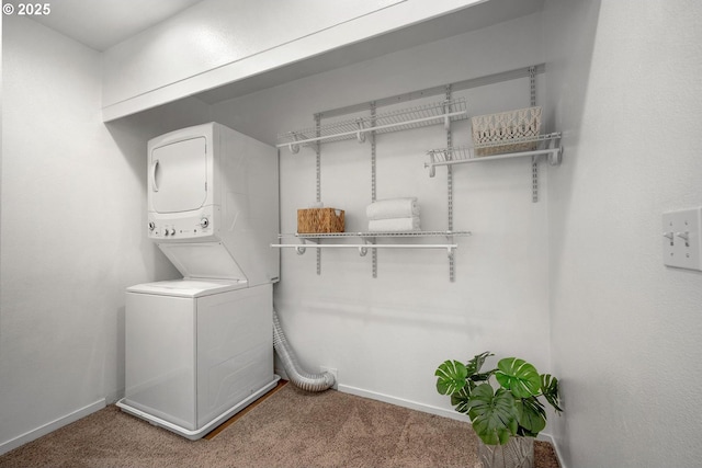1535 SW Clay St Unit 238, Portland, OR 97201 - laundry area with stacked washer / drying machine, carpet floors, and baseboards