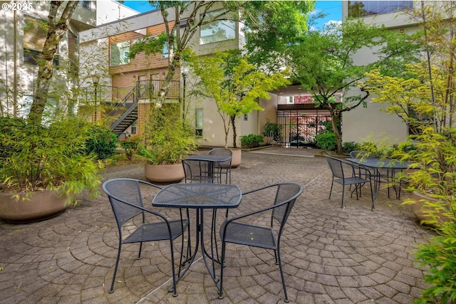 1535 SW Clay St Unit 238, Portland, OR 97201 - view of patio / terrace featuring outdoor dining area and stairs