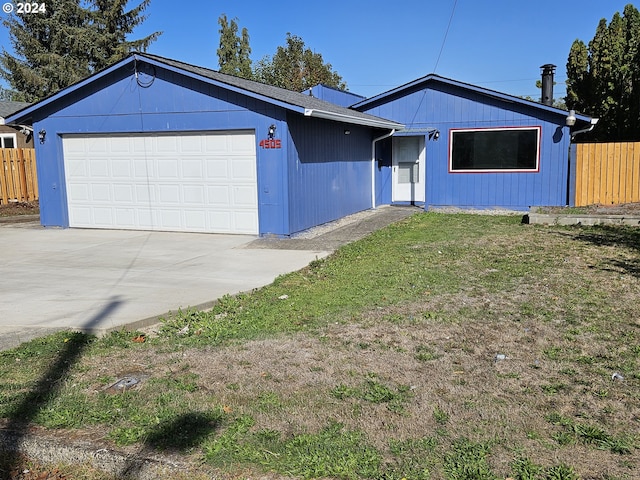 4505 NE Emerson St, Portland, OR 97218 - ranch-style house featuring fence, driveway, a front yard, and a garage