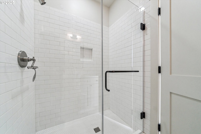 full bath featuring a shower stall