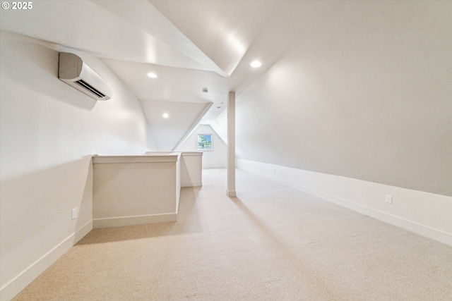 hall featuring lofted ceiling, a wall mounted AC, recessed lighting, carpet floors, and baseboards
