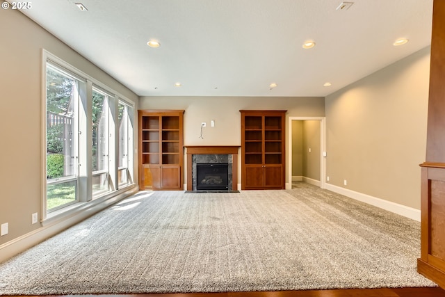 14702 SE Badger Creek Rd, Happy Valley, OR 97086 - unfurnished living room featuring a high end fireplace, carpet flooring, and recessed lighting