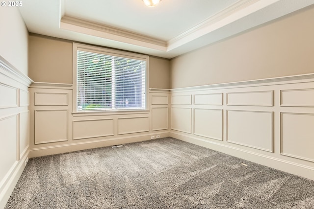 14702 SE Badger Creek Rd, Happy Valley, OR 97086 - unfurnished room featuring a decorative wall, ornamental molding, a wainscoted wall, carpet flooring, and a tray ceiling