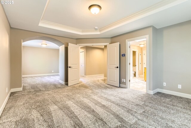 14702 SE Badger Creek Rd, Happy Valley, OR 97086 - carpeted spare room featuring arched walkways, a raised ceiling, crown molding, and a smoke detector