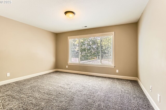 14702 SE Badger Creek Rd, Happy Valley, OR 97086 - carpeted empty room featuring baseboards
