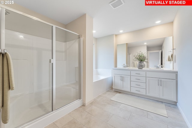 full bathroom featuring recessed lighting, a sink, visible vents, and a shower stall