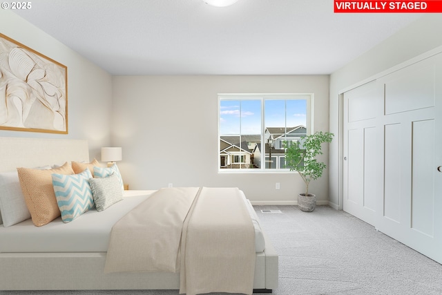 carpeted bedroom featuring visible vents and baseboards