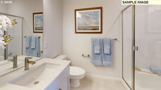 bathroom with vanity, toilet, and a stall shower