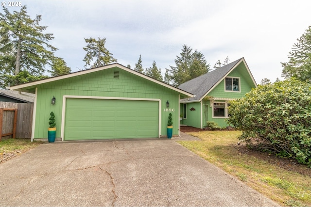 1896 W Park Dr, Florence, OR 97439 - view of front of property featuring driveway and an attached garage