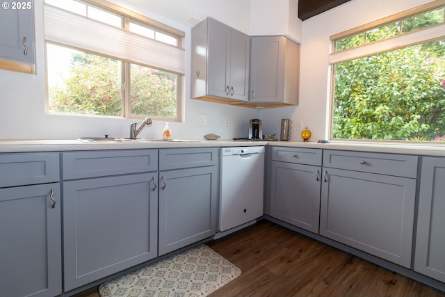 1896 W Park Dr, Florence, OR 97439 - kitchen featuring dishwasher, a sink, light countertops, dark wood-type flooring, and gray cabinetry