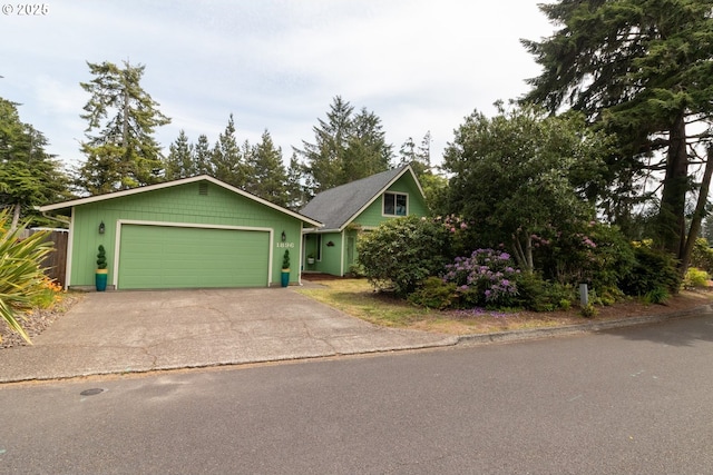 1896 W Park Dr, Florence, OR 97439 - view of front of home featuring an attached garage and driveway