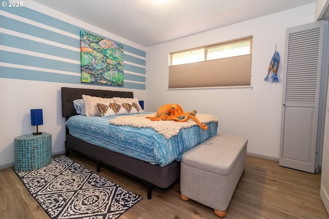 1896 W Park Dr, Florence, OR 97439 - bedroom with wood finished floors and baseboards