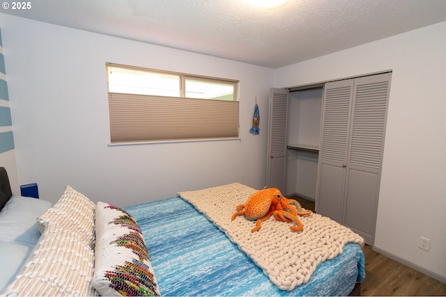 1896 W Park Dr, Florence, OR 97439 - bedroom featuring wood finished floors and a closet