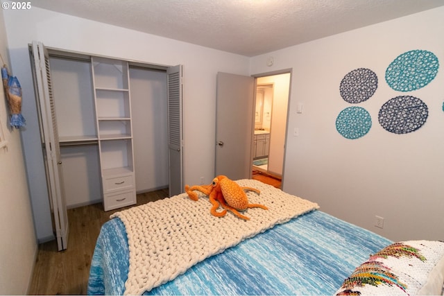 1896 W Park Dr, Florence, OR 97439 - bedroom with wood finished floors, a closet, and baseboards