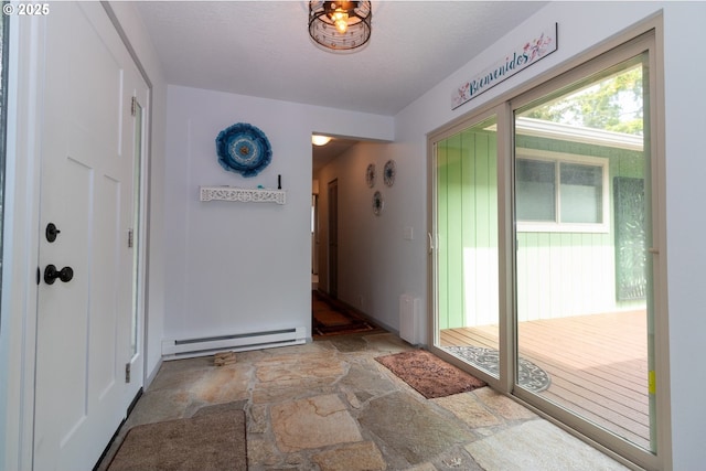 1896 W Park Dr, Florence, OR 97439 - foyer entrance with baseboard heating and light stone finish floors