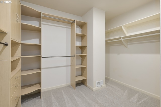 walk in closet with carpet flooring and visible vents