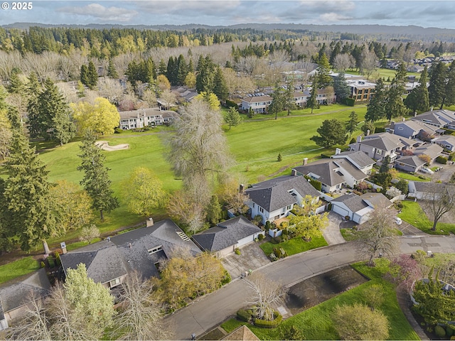 drone / aerial view with a view of trees and a residential view