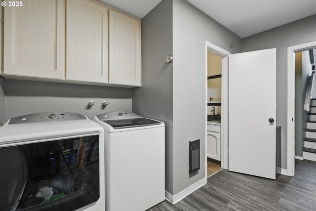 6816 NE 65th Ave, Vancouver, WA 98661 - washroom featuring washing machine and dryer, dark wood-type flooring, baseboards, and cabinet space