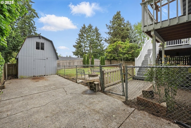 6816 NE 65th Ave, Vancouver, WA 98661 - view of patio featuring a gate, a fenced backyard, stairs, an outdoor structure, and a storage shed