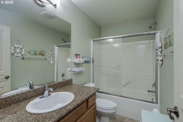 bathroom with vanity, toilet, and enclosed tub / shower combo