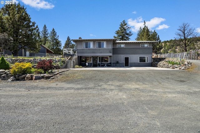 204 Adam Dr, Canyon City, OR 97820 - view of front facade with fence and a chimney