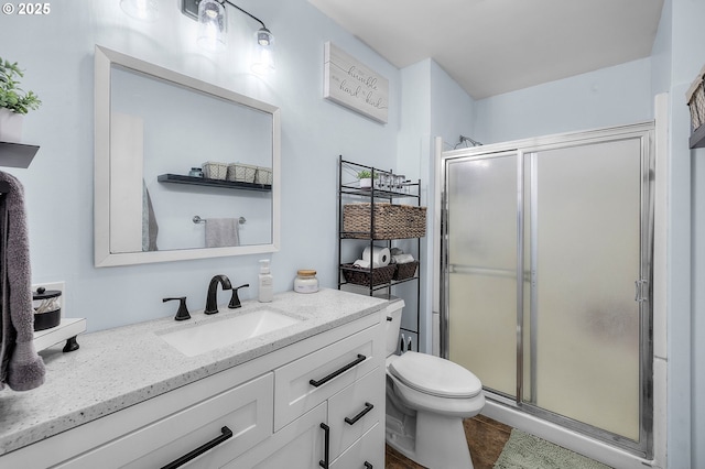 204 Adam Dr, Canyon City, OR 97820 - full bathroom featuring a shower stall, vanity, toilet, and tile patterned flooring