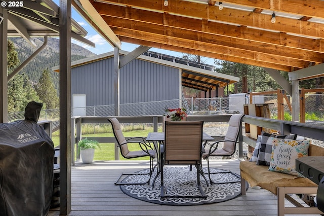 204 Adam Dr, Canyon City, OR 97820 - wooden deck featuring outdoor dining area, fence, and a grill
