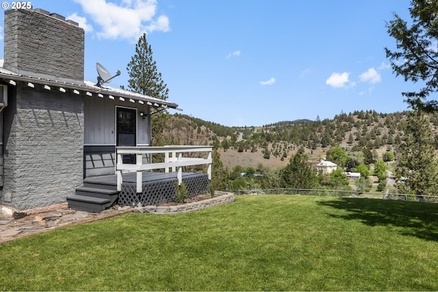 204 Adam Dr, Canyon City, OR 97820 - view of green lawn with a deck with mountain view