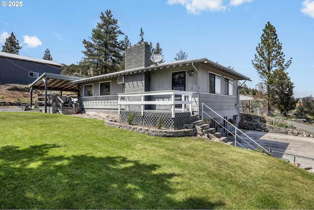 204 Adam Dr, Canyon City, OR 97820 - view of front of property featuring a chimney, a front yard, and a wooden deck