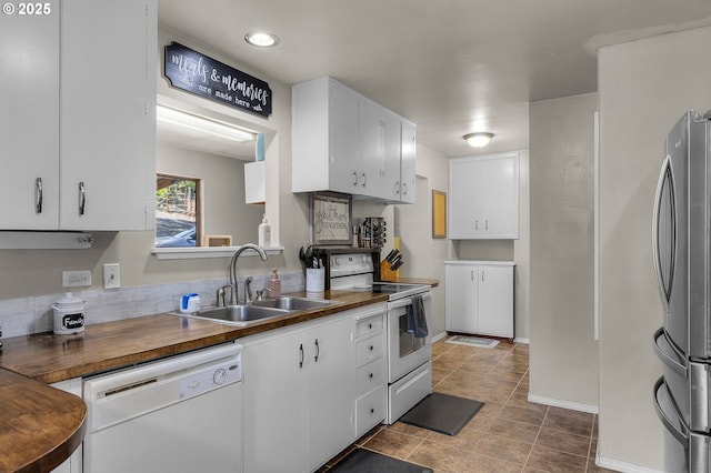 204 Adam Dr, Canyon City, OR 97820 - kitchen featuring white appliances, a sink, white cabinetry, tile patterned floors, and wooden counters