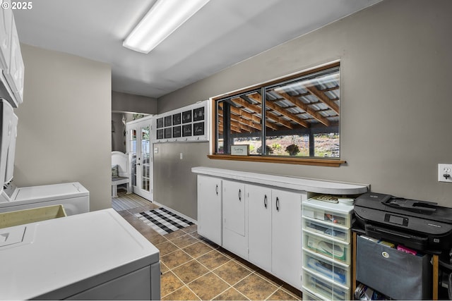 204 Adam Dr, Canyon City, OR 97820 - washroom featuring cabinet space, independent washer and dryer, dark tile patterned floors, and french doors