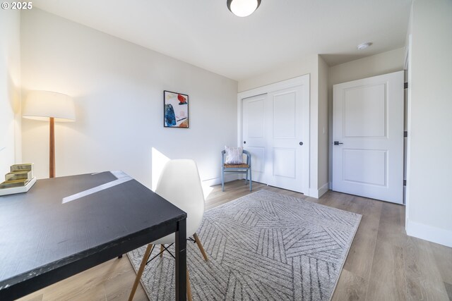 office featuring wood finished floors and baseboards