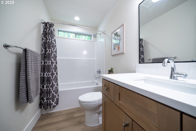bathroom with vanity, shower / tub combo, wood finished floors, and toilet