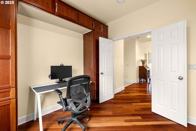 office area featuring baseboards and dark wood-style flooring