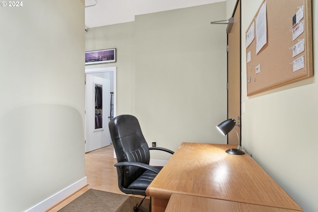office featuring baseboards and wood finished floors