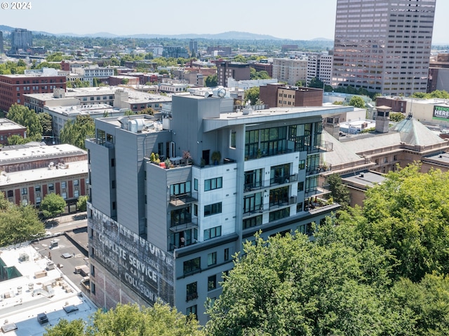 drone / aerial view with a view of city and a mountain view