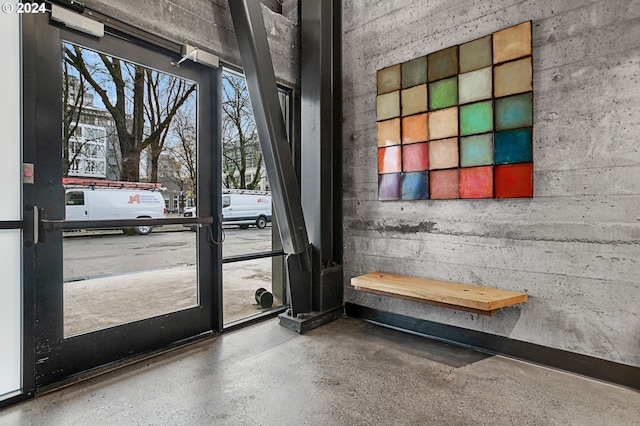 doorway featuring speckled floor