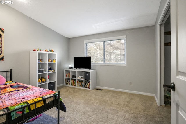 carpeted bedroom with vaulted ceiling