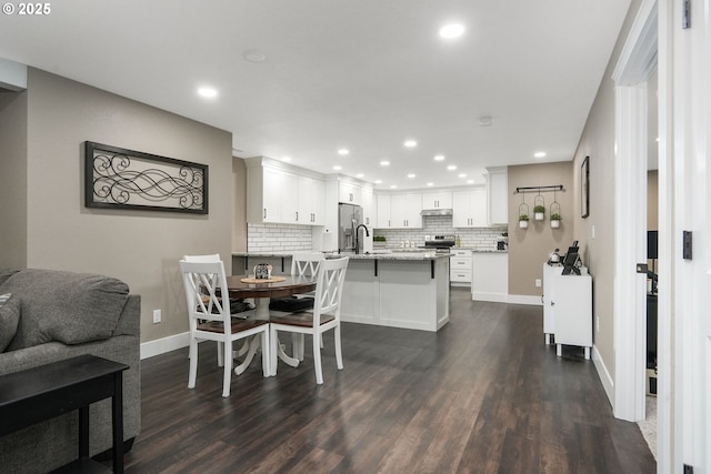 dining space with dark wood-type flooring