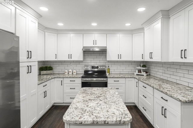 kitchen featuring white cabinetry, appliances with stainless steel finishes, and light stone countertops