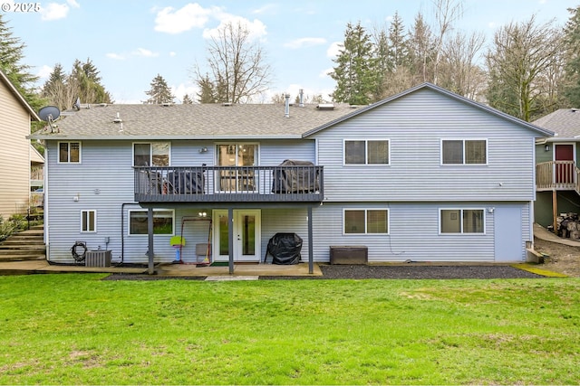 rear view of house with central AC, a patio, a deck, and a lawn