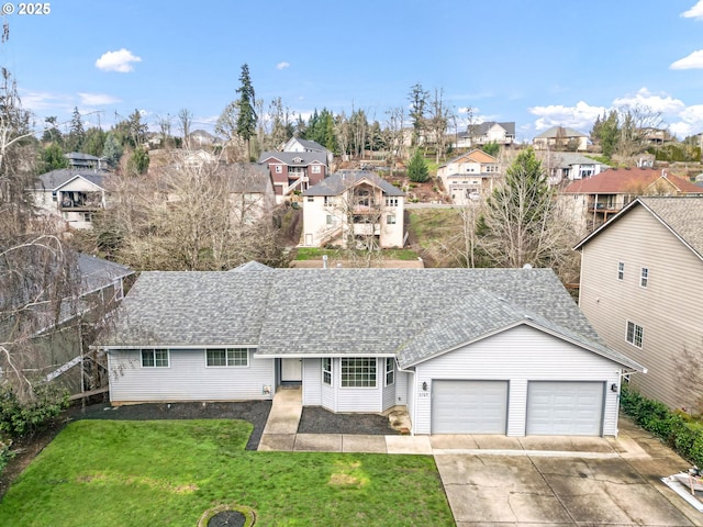 view of front of house featuring a garage and a front yard