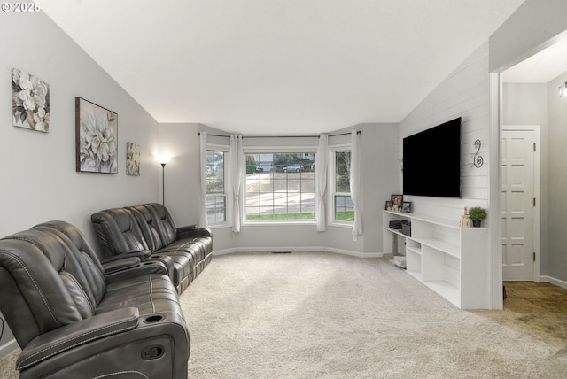 living room featuring light colored carpet and vaulted ceiling