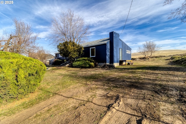 view of property exterior featuring a yard